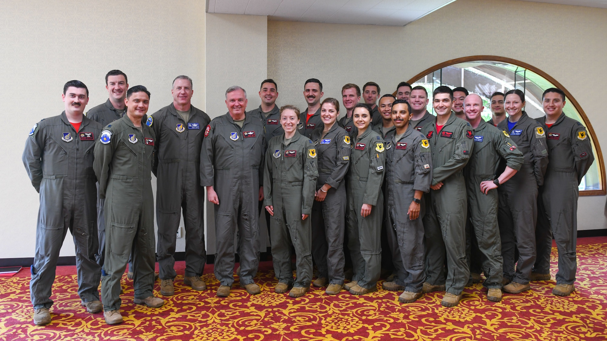 Group photo of air crews with Lt. Gen. Ricky Rupp.