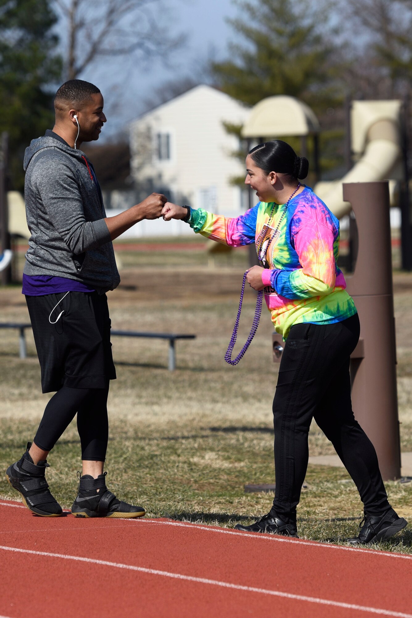 U.S. Air Force Master Sgt. Cornelius Horne, 316th Force Support Squadron career assistance advisor and Diversity and Inclusion chair, left, and U.S. Air Force Tech. Sgt. Krystal Molina, 459th Air Refueling Wing Equal Opportunity specialist, greet each other at Joint Base Andrews, Md., March 5, 2022