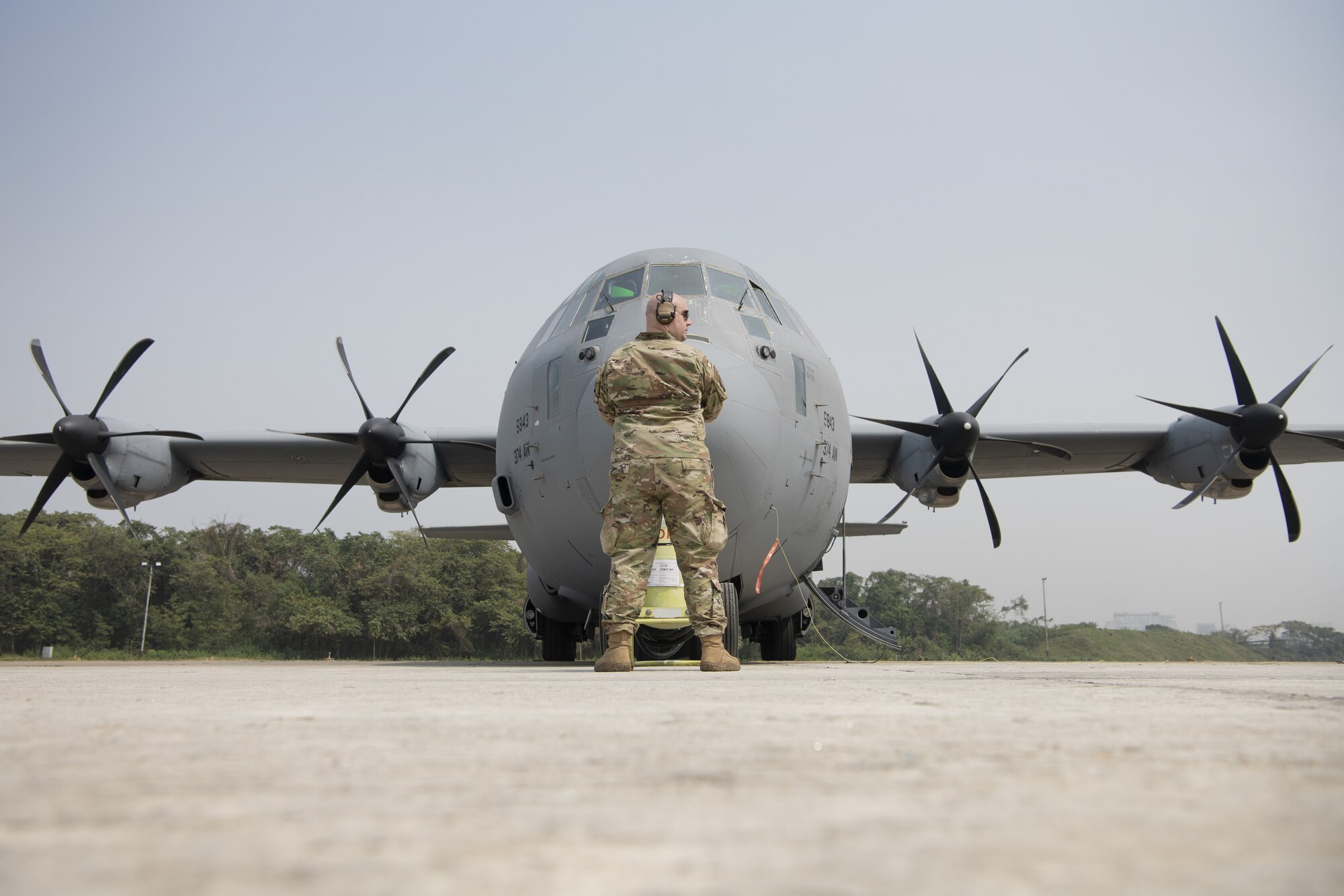 Staff Sgt. Aaron Estrello, 36th Expeditionary Airlift Squadron electrical and environmental craftsman, helps prepare a C-130J Super Hercules for launch during Exercise Cope South 2022, Feb. 24, 2022, at Bangladesh air force (BAF) Base Bangabandhu, Bangladesh. U.S. Air Force and BAF participants conducted static line and high altitude, low opening (HALO) jumps, low level flying, and night flights during the exercise to enhance their interoperability. Exercise Cope South is a bi-annual Pacific Air Forces-sponsored bilateral exercise that provides U.S. and Bangladesh air forces the opportunity to work together while performing tactical airlift scenarios.