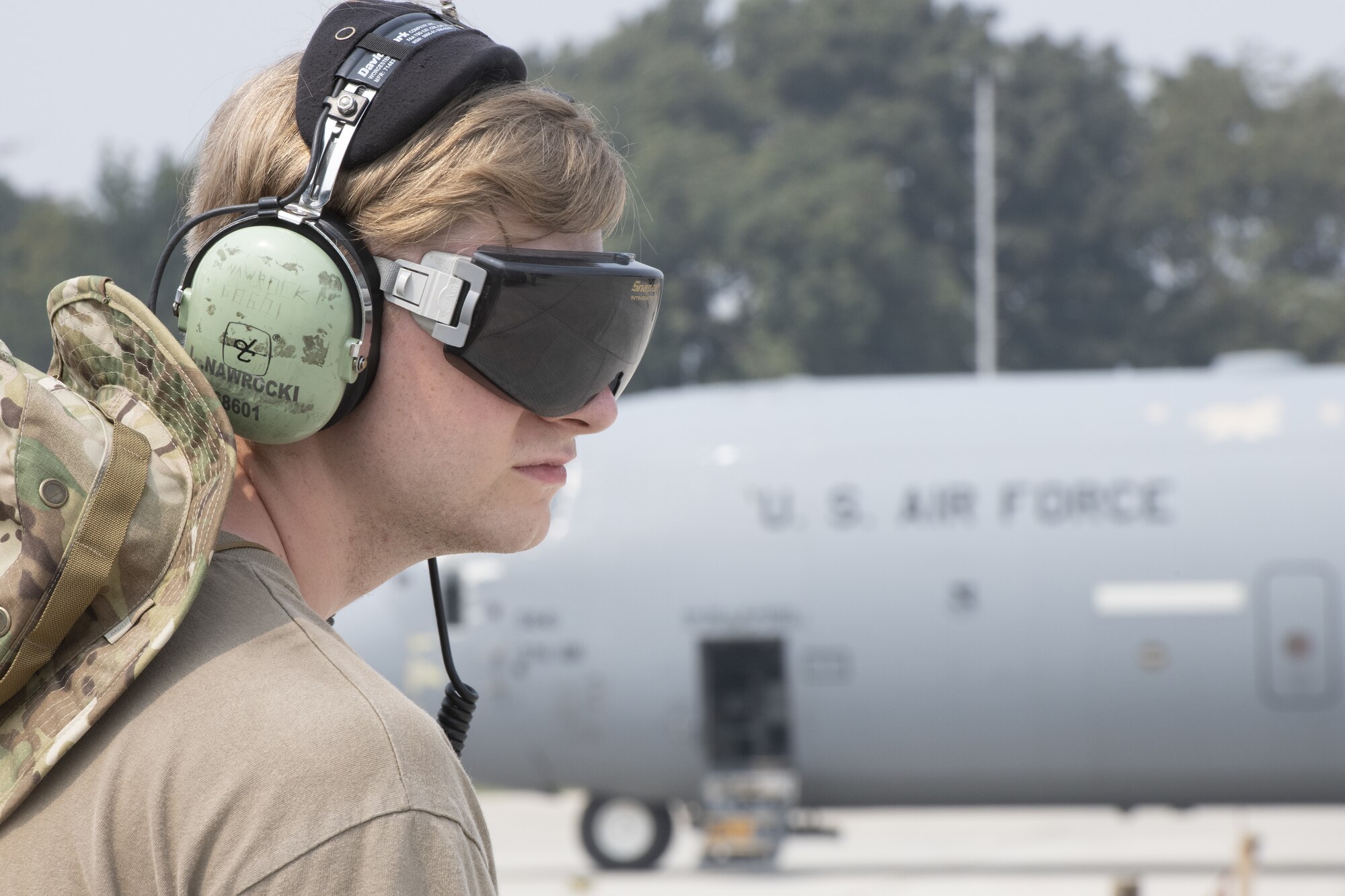 Senior Airman Logan Nawrocki, 36th Expeditionary Airlift Squadron integrated communication navigation mission systems and electronic warfare journeyman, prepares to marshal a C-130J Super Hercules during Exercise Cope South 2022, Feb. 24, 2022, at Bangladesh air force (BAF) Base Bangabandhu, Bangladesh. U.S. Air Force and BAF participants conducted static line and high altitude, low opening (HALO) jumps, low level flying, and night flights during the exercise to enhance their interoperability. Exercise Cope South is a bi-annual Pacific Air Forces-sponsored bilateral exercise that provides U.S. and Bangladesh air forces the opportunity to work together while performing tactical airlift scenarios.