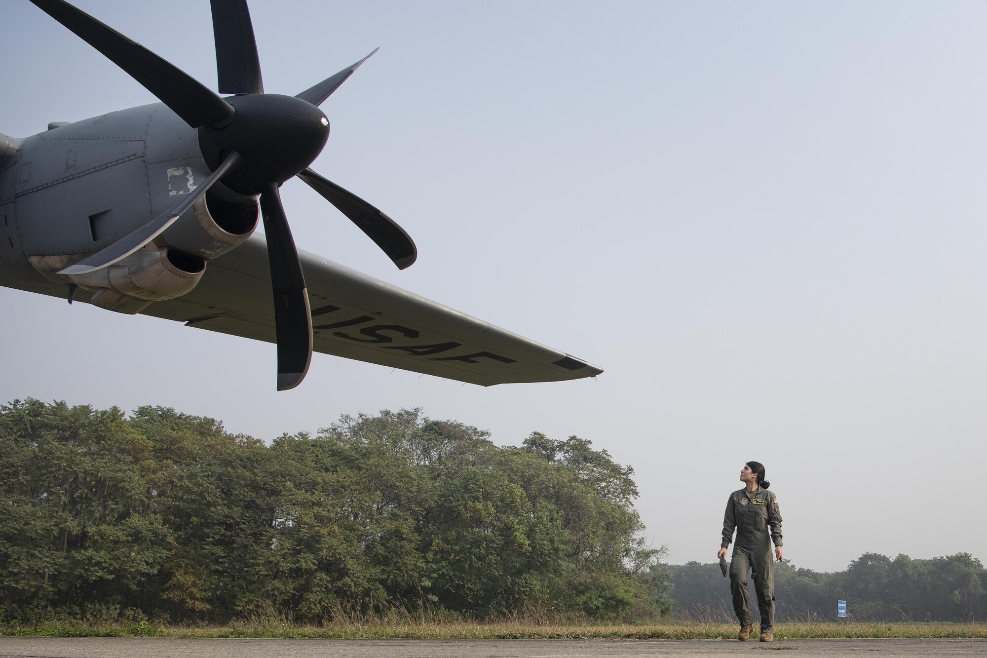 Senior Airman Kristen Garcia, 36th Expeditionary Airlift Squadron loadmaster, inspects the wing of a C-130J Super Hercules prior to launch in support of Exercise Cope South 2022 Feb. 22, 2022, at Bangladesh air force (BAF) Base Bangabandhu, Bangladesh. U.S. and Bangladesh air forces conducted static line and high altitude, low opening (HALO) jumps during the exercise. The bilateral exercise provides an opportunity for Pacific Air Forces and the BAF to strengthen their relationship and enhance interoperability, to operate more effectively together when needed.