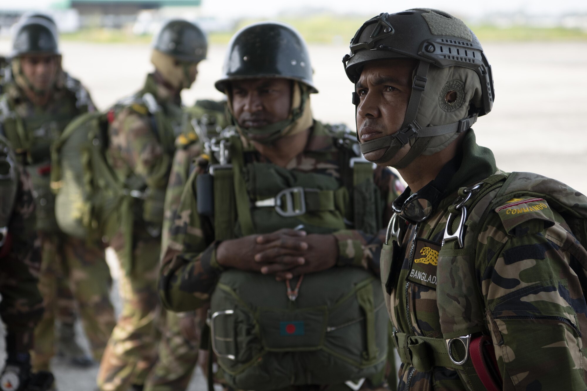 Bangladesh armed forces prepare to board a C-130J Super Hercules assigned to the 36th Expeditionary Airlift Squadron to perform static line and high altitude, low opening (HALO) jumps during Exercise Cope South 2022, Feb. 22, 2022, at Sylhet, Bangladesh. Exercise Cope South provides an opportunity for Pacific Air Forces and the Bangladesh armed forces to strengthen their relationship and enhance interoperability, to operate more effectively together when needed.