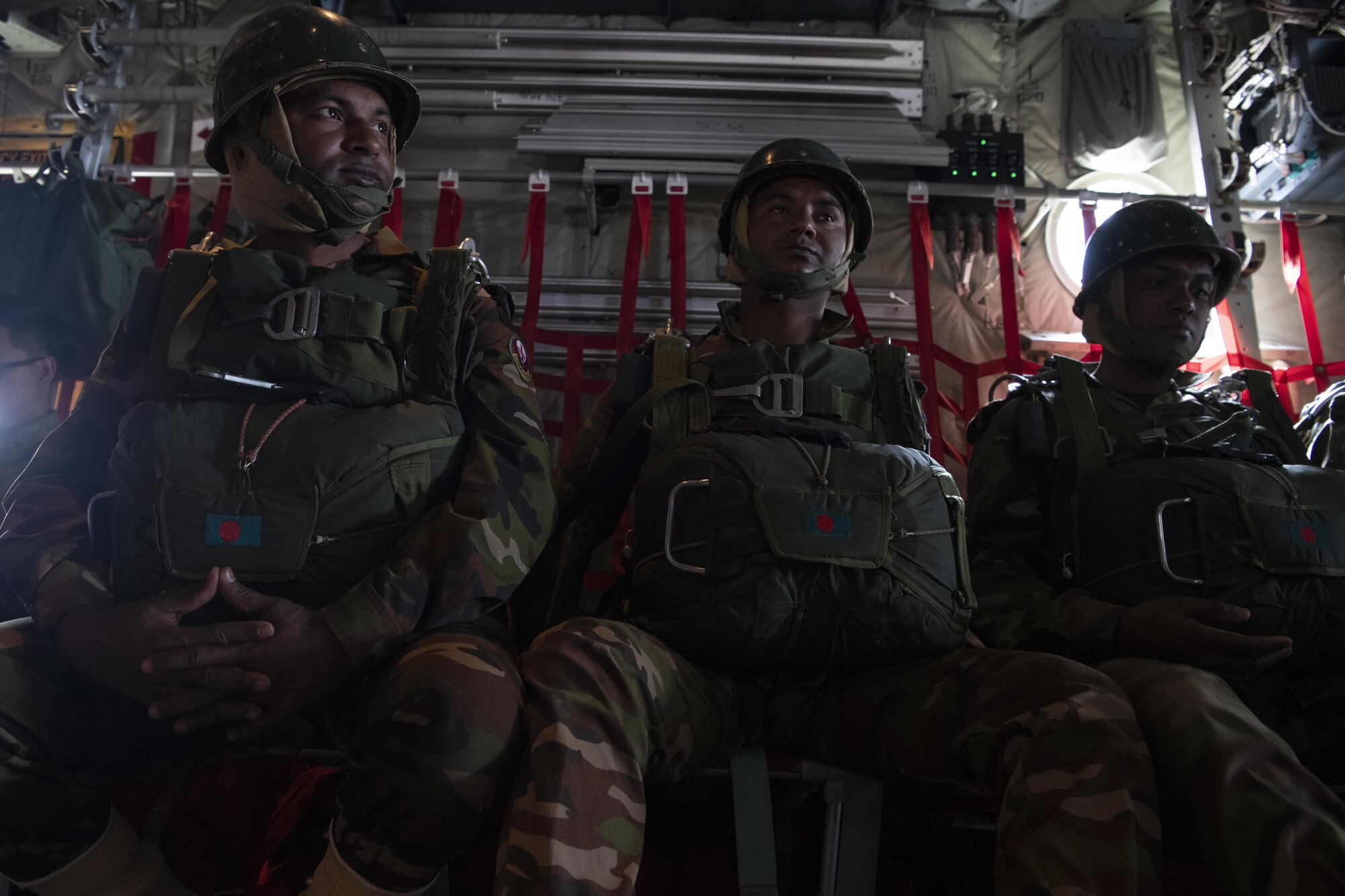 Bangladesh armed forces prepare for launch on a C-130J Super Hercules assigned to the 36th Expeditionary Airlift Squadron, in preparation to perform static line and high altitude, low opening (HALO) jumps during Exercise Cope South 2022, Feb. 22, 2022, at Sylhet, Bangladesh. The bilateral exercise provides an opportunity for Pacific Air Forces and the BAF to strengthen their relationship and enhance interoperability, to operate more effectively together when needed.