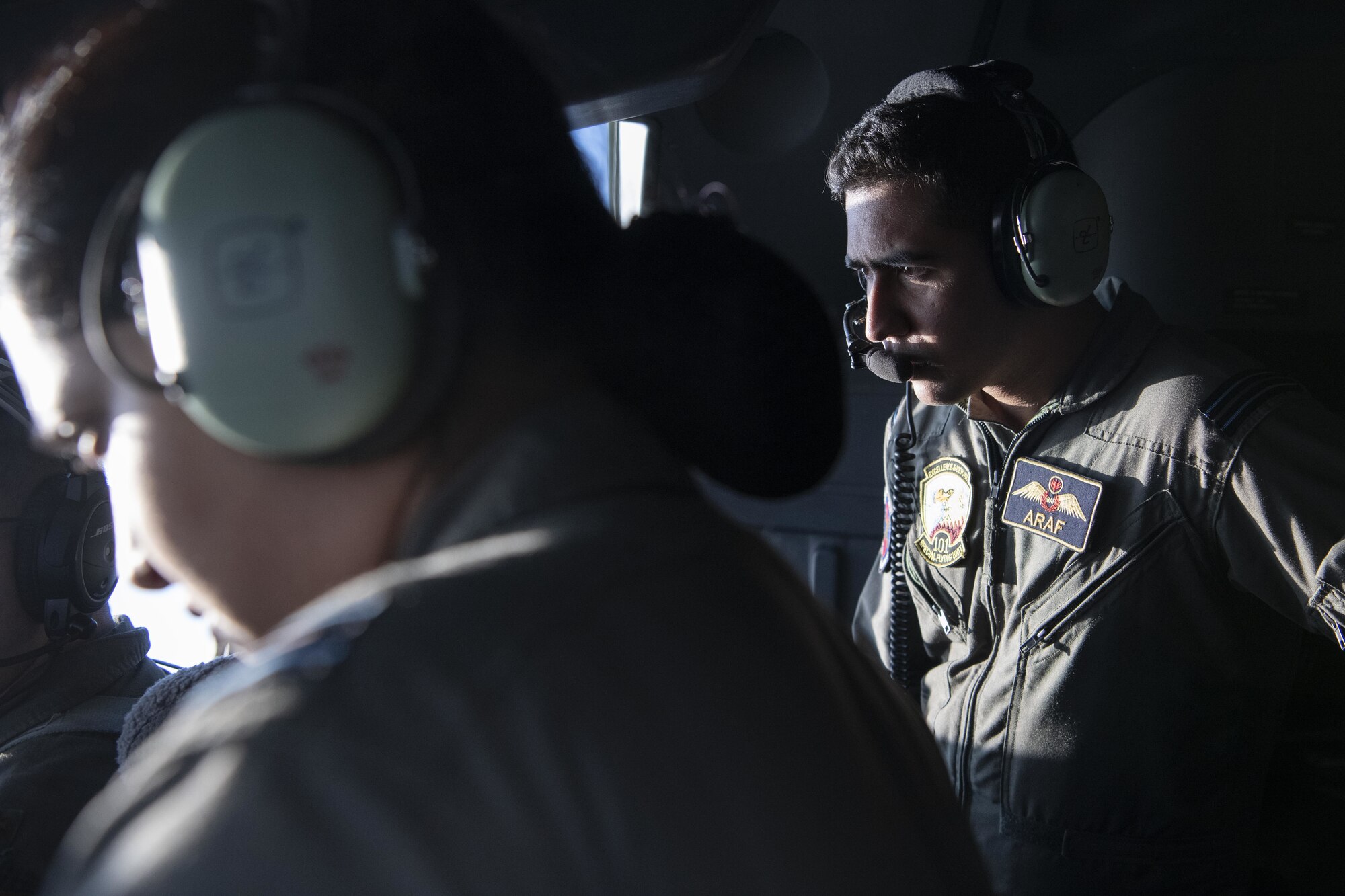Flight Lieutenant Araf Billah, right, and Flight Lieutenant Sabiqun Nahar Chodhury, left, Bangladesh air force (BAF) C-130 Hercules pilots, observe U.S. Air Force pilots assigned to the 36th Expeditionary Airlift Squadron, as they pilot a C-130J Super Hercules during Exercise Cope South 2022, Feb. 22, 2022, over Bangladesh. U.S. and Bangladesh air forces conducted static line and high altitude, low opening (HALO) jumps during the exercise. The bilateral exercise provides an opportunity for Pacific Air Forces and the BAF to strengthen their relationship and enhance interoperability, to operate more effectively together when needed.