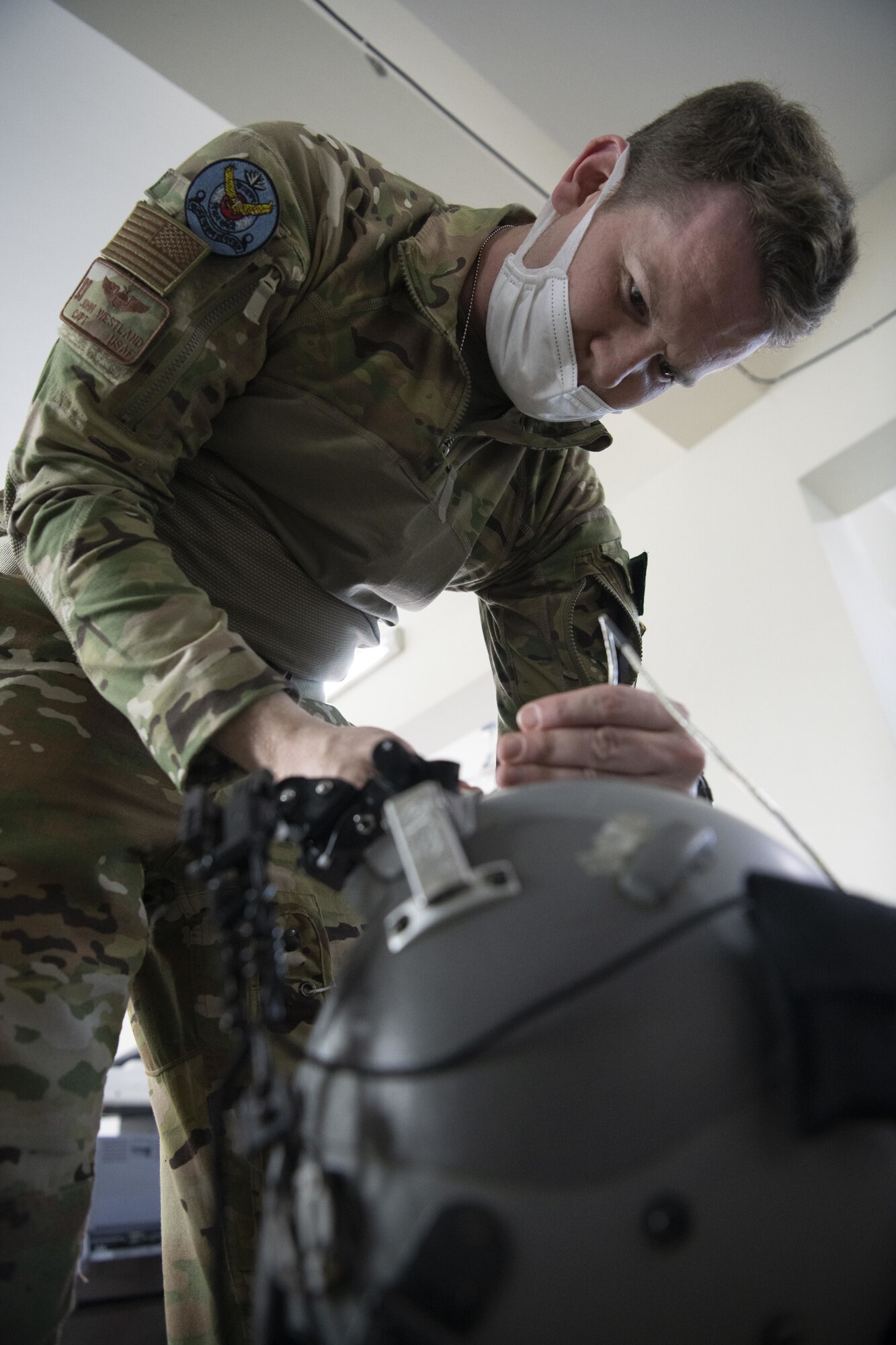 Capt. Johnathan Westland, 36th Expeditionary Airlift Squadron C-130J Super Hercules pilot, prepares his night vision goggles for a night sortie during Exercise Cope South 2022, Feb. 24, 2022, at Bangladesh air force (BAF) Base Bangabandhu, Bangladesh. U.S. Air Force and BAF pilots exchanged techniques for flying in low light conditions as part of the exercise. Exercise Cope South is a bi-annual Pacific Air Forces-sponsored bilateral tactical airlift exercise, intended to enhance U.S. and Bangladesh forces’ ability to operate together.