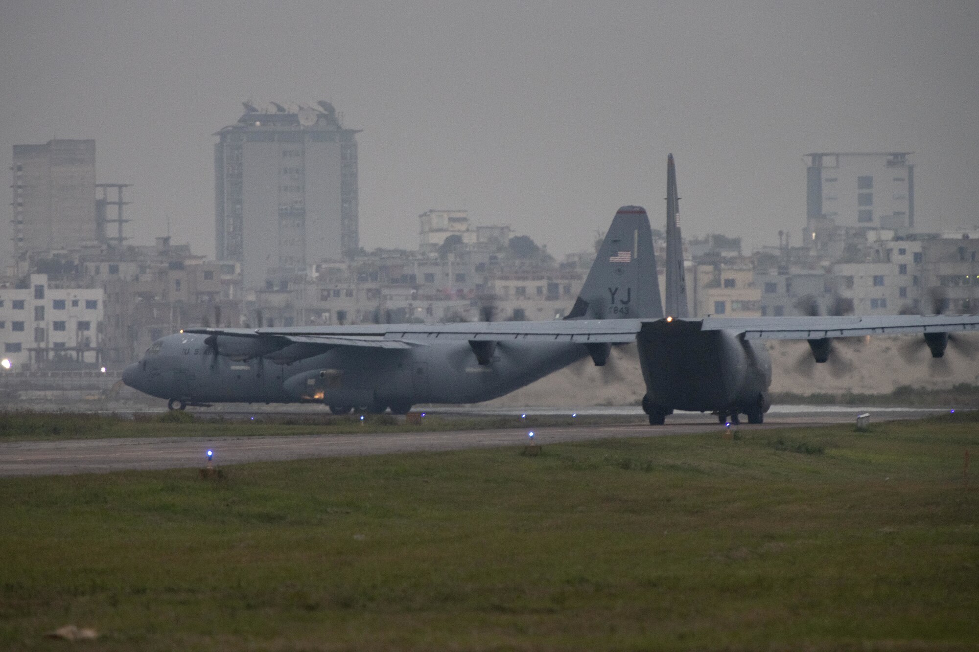 U.S. Air Force C-130J Super Hercules pilots, 36th Expeditionary Airlift Squadron, taxi toward the runway at Bangladesh Air Force (BAF) Base Bangabandhu, as BAF C-130 pilots on board observe, during a night sortie as part of Exercise Cope South 2022, Feb. 24, 2022, in Bangladesh. U.S. Air Force and BAF pilots exchanged techniques for flying in low light conditions as part of the exercise. Exercise Cope South tests the ability of more than 70 U.S. Air Force Airmen and approximately 300 BAF personnel to perform tactical airlift tasks together.