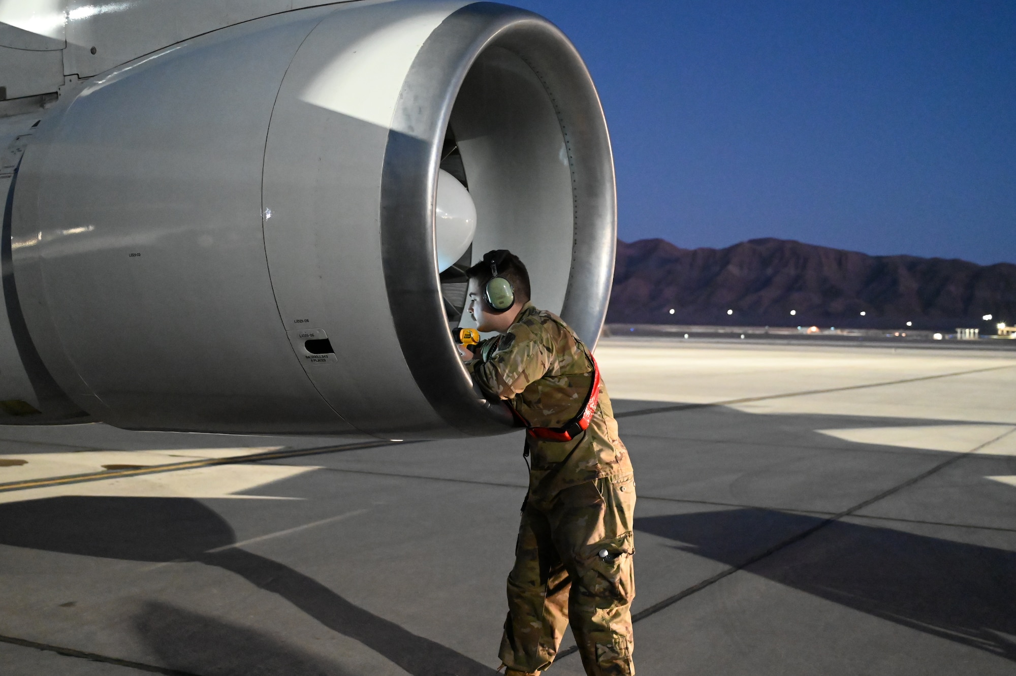 crews inspecting a plane