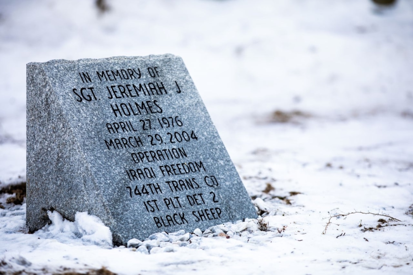 A granite marker honoring the service of Sgt. Jeremiah Holmes is rededicated at the Hillsborough armory March 5, 2022.