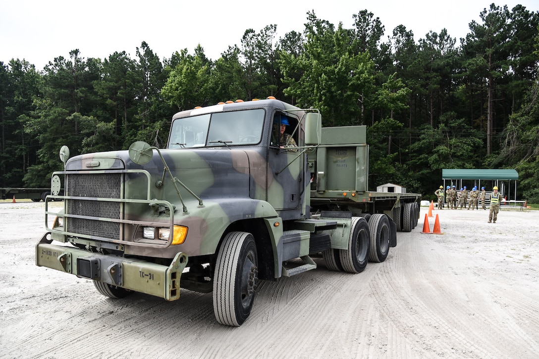 U.S. Army Soldiers from across the nation practice alley docking an M915s during an 88M Motor Transport Operator Course, taught by cadre assigned to 2nd Battalion, 183rd Regiment, Regional Training Institute Aug. 2, 2021, at Fort Pickett, Virginia. Successful completion of the two-phase, four-week course will certify Soldiers as 88M Motor Transport Operators with the primary responsibility of operating wheeled vehicles. (U.S. Army National Guard photo by Sgt. 1st Class Terra C. Gatti)