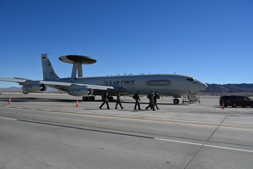 Crew walking towards AWACS aircraft