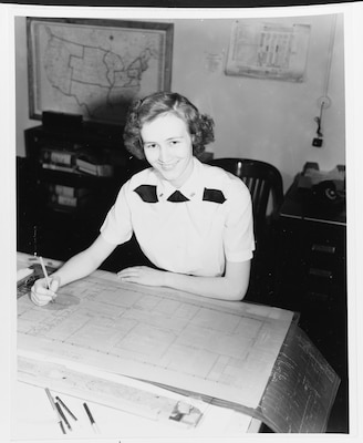 Black white photo of woman smiling at camera