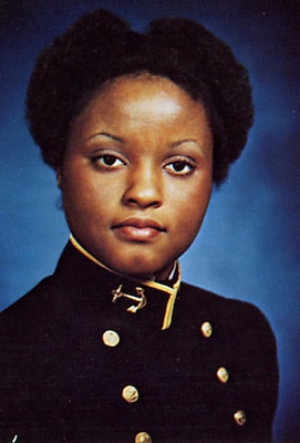 Portrait of woman in her uniform with blue background