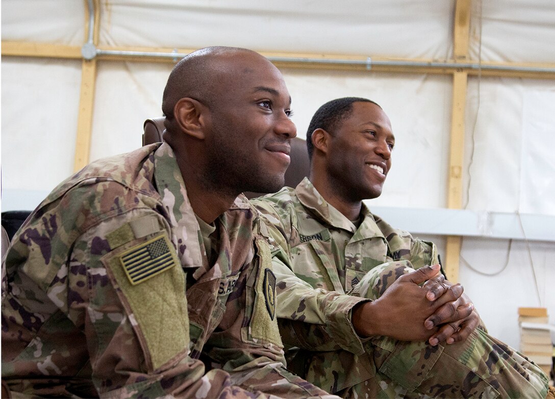 Sgt. Andrew Miller and Staff Sgt. Carl Patterson with the 300th Sustainment Brigade participating in the Army Ask - Care - Escort (ACE) Suicide Intervention training at Camp Arifjan, Kuwait, Feb. 8, 2019.