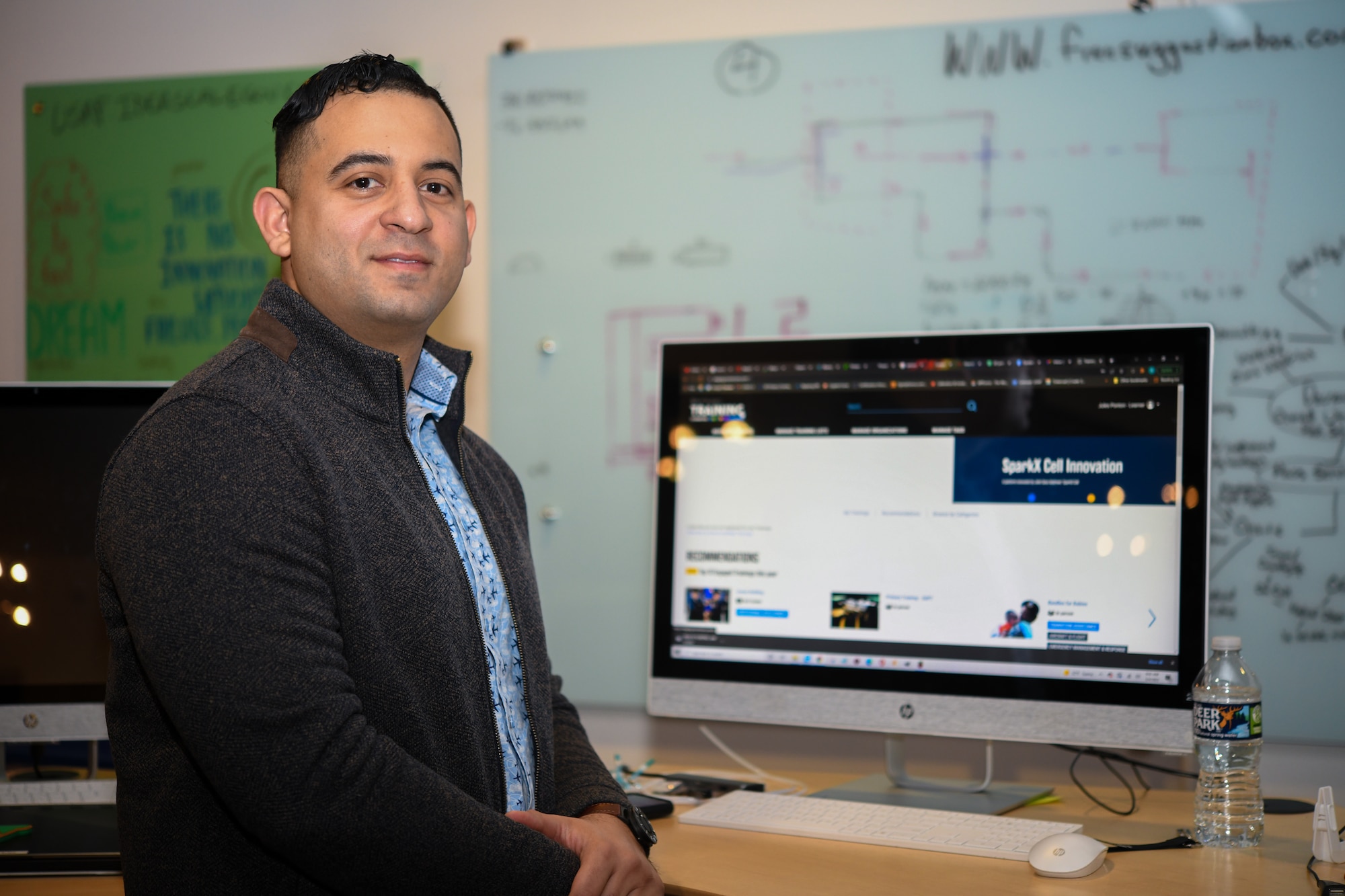 Tech. Sgt. Jules Ponton, former 316th Force Support Squadron manpower analyst and now Education With Industry Fellow at Deloitte Consulting analyst, poses for a photo at SparkX Cell Innovation & Idea Center on Joint Base Andrews, Md., March 4, 2022.