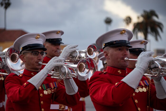 U.S. Marines with Marine Drum and Bugle Corps, Battle Color Detachment, Marine Barracks Washington, D.C., preform during the centennial celebration at Marine Corps Recruit Depot San Diego, March 5, 2022. MCRD San Diego celebrated the 100th anniversary of its commissioning by highlighting the Depot’s history and legacy with the assistance of the Marine Corps Battle Color Detachment. The Battle Color Detachment is comprised of three  ceremonial units from Marine Barracks Washington, D.C.; the U.S. Drum and Bugle Corps, the Silent Drill Platoon, and the Marine Corps Color Guard.