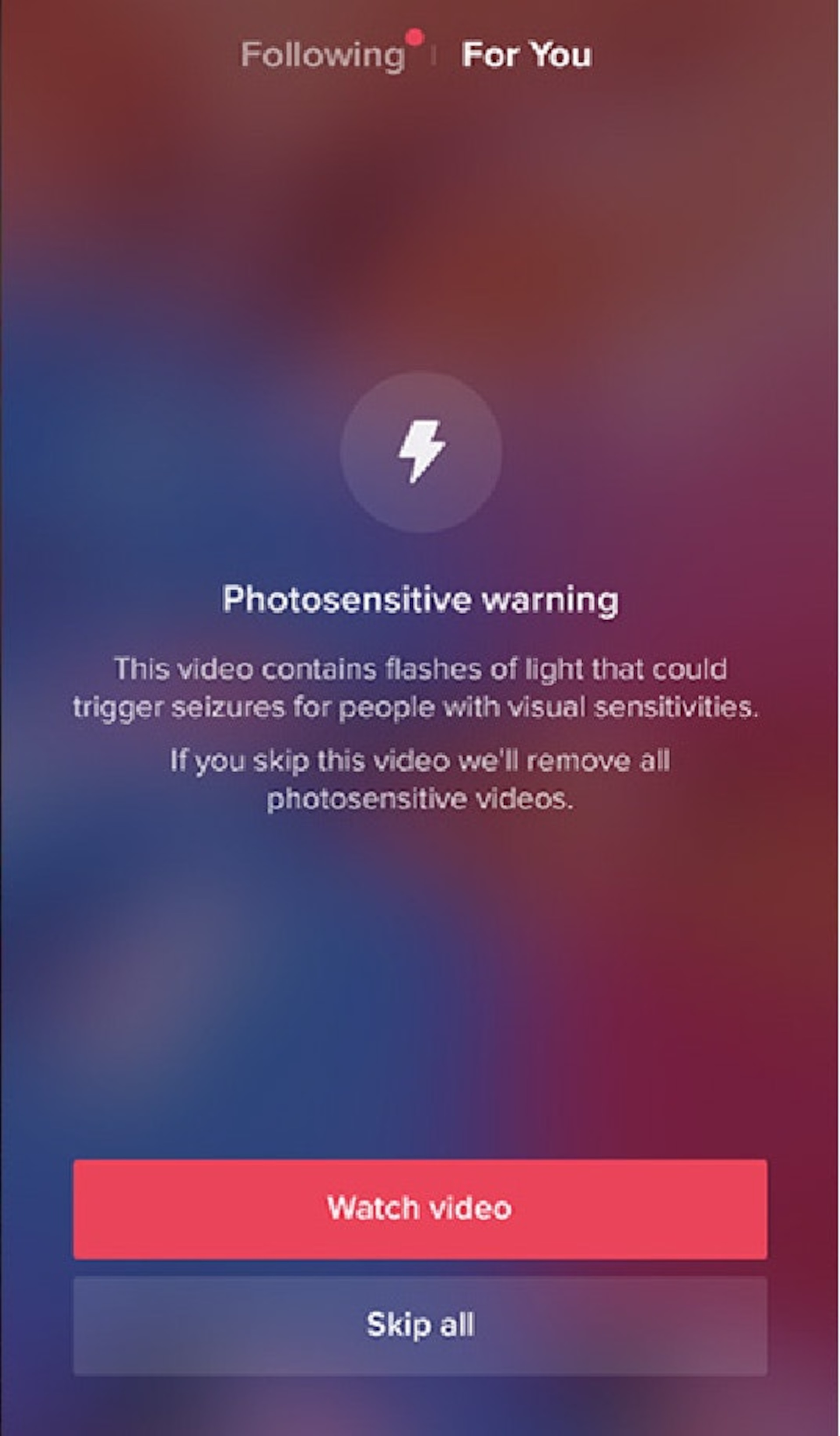 This screenshot is an example of a photosensitive warning feature available in the social media application TikTok. It allows users the option to automatically hide sensitive photosensitive videos.