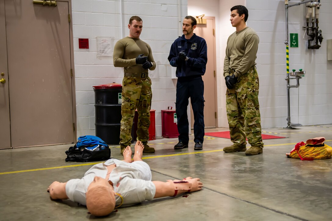 Personnel with the 28th Civil Engineer Squadron, go over the parameters of a trauma scenario on Ellsworth Air Force Base, S.D., March 3, 2022.
