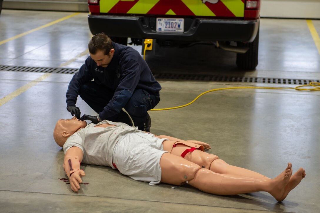 Mr. Kyle Brown, a fire protection engineer with the 28th Civil Engineer Squadron, prepares a training mannequin on Ellsworth Air Force Base, S.D., March 3, 2022.