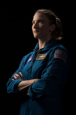 Official portrait photo of woman in her astronaut uniform
