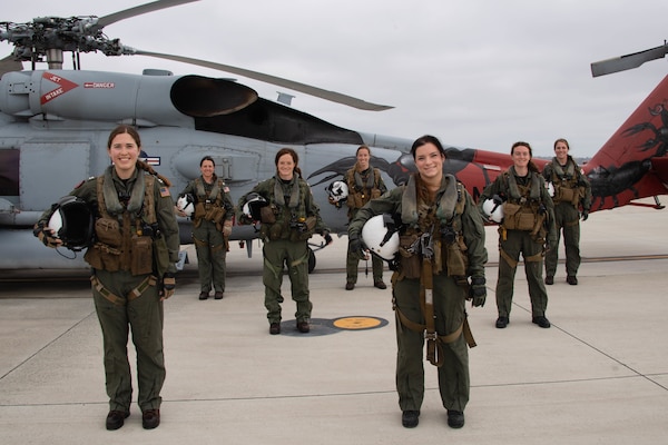 Navy pilots and aircrew from Helicopter Maritime Strike Squadron (HSM) 49 and Helicopter Maritime Strike Squadron (HSM) 41 pose for a photo before taking off on the first all-women crew MH- 60R Sea Hawk training flight