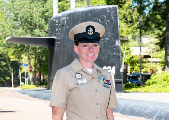 Smiling woman in her beige uniform on the base