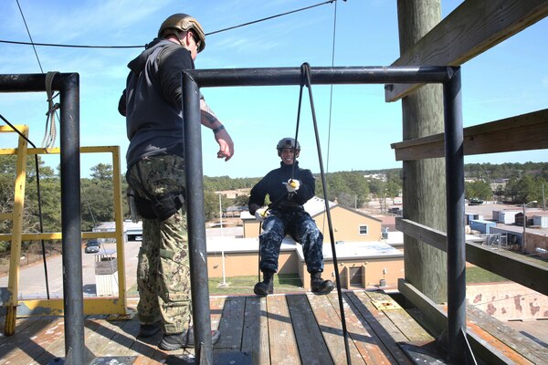 Command Master Chief Marluis Stokes practices repelling techniques at Naval Expeditionary Combat Command on board Joint-Expeditionary Base Little Creek-Fort Story