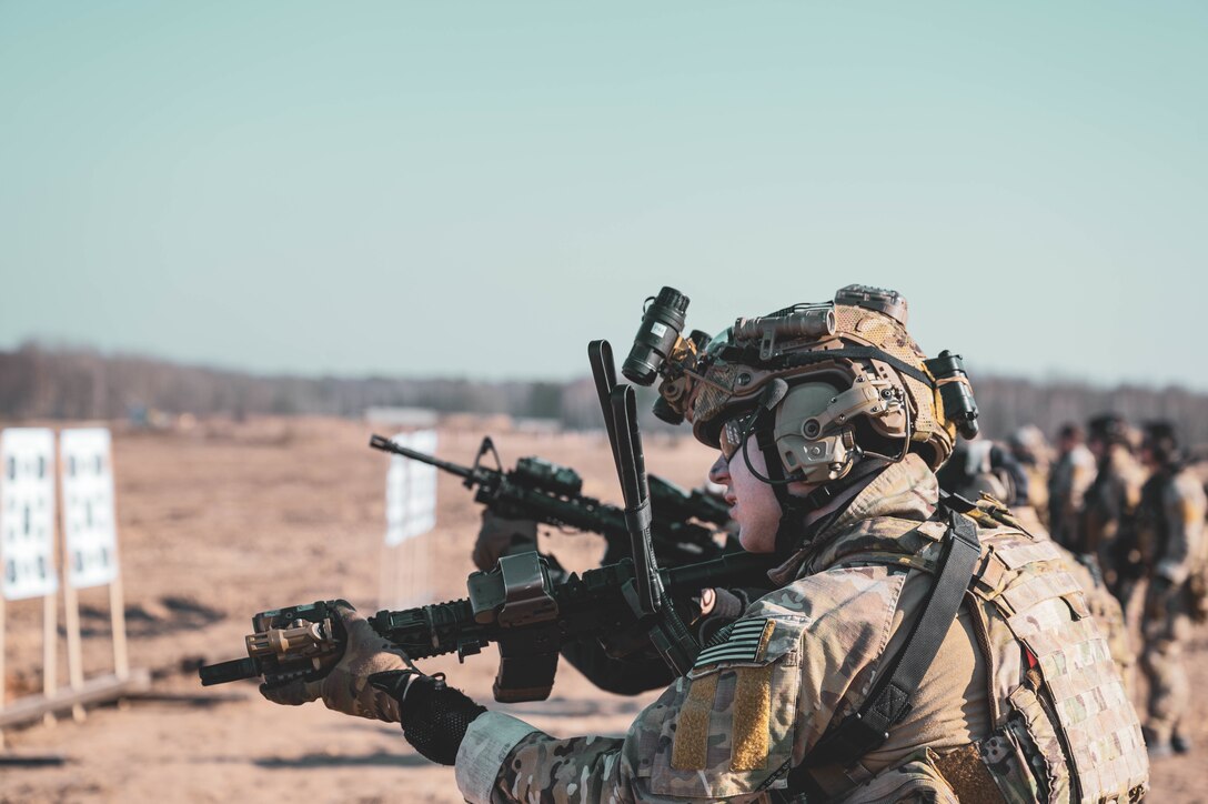 An airman fires rifle.