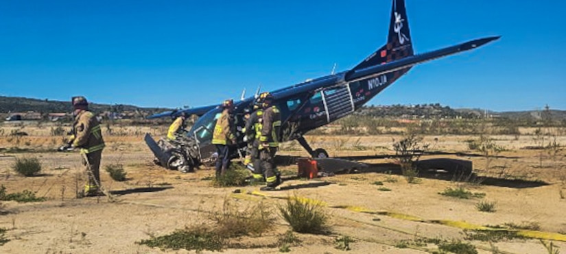 A fire rescue team renders aid to the victims of the plane crash near Oceanside Municipal Airport, California on Feb. 24, 2022. U.S. Army Reserve Staff Sgt. Christopher Gordon, a civil affairs Non-commissioned Officer with the 416th Civil Affairs Battalion (Airborne), was one of three pedestrians responsible for aiding the victims of a plane crash. (U.S. Army Reserve photo by Staff Sgt. Christopher Gordon)