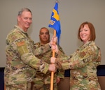Col. Terry W. McClain, 433rd Airlift Wing commander, Col. Wayne M. Williams, former 433rd Mission Support Group commander, applaud Col. Jeanne E. Bisesi, for taking command of the 433rd MSG during a ceremony at Joint Base San Antonio-Lackland, Texas, March 5, 2022. The ceremony allowed Williams to say farewell and Bisesi to officially greet 433rd MSG personnel under her command. (U.S. Air Force photo by Airman Mark Colmenares)