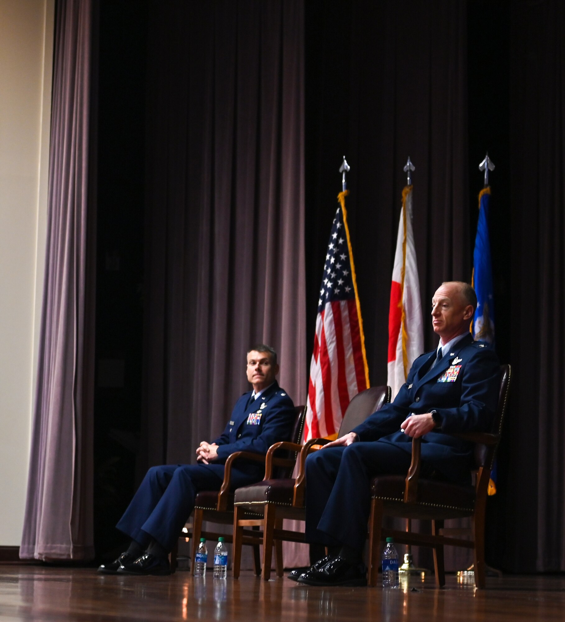 U.S. Air Force Col. Seth Graham (Right), 14th Flying Training Wing commander, and U.S. Air Force Lt. Col. Nathaniel Wilds, 50th Flying Training Squadron commander (Left), sit at Specialized Undergraduate Pilot Training Class 22-06’s graduation on March 4, 2022, at Columbus Air Force Base, Miss. As the 50th FTS commander, Wilds’ squadron is responsible for pilot training in the T-38C Talon. (U.S. Air Force photo by Senior Airman Davis Donaldson)