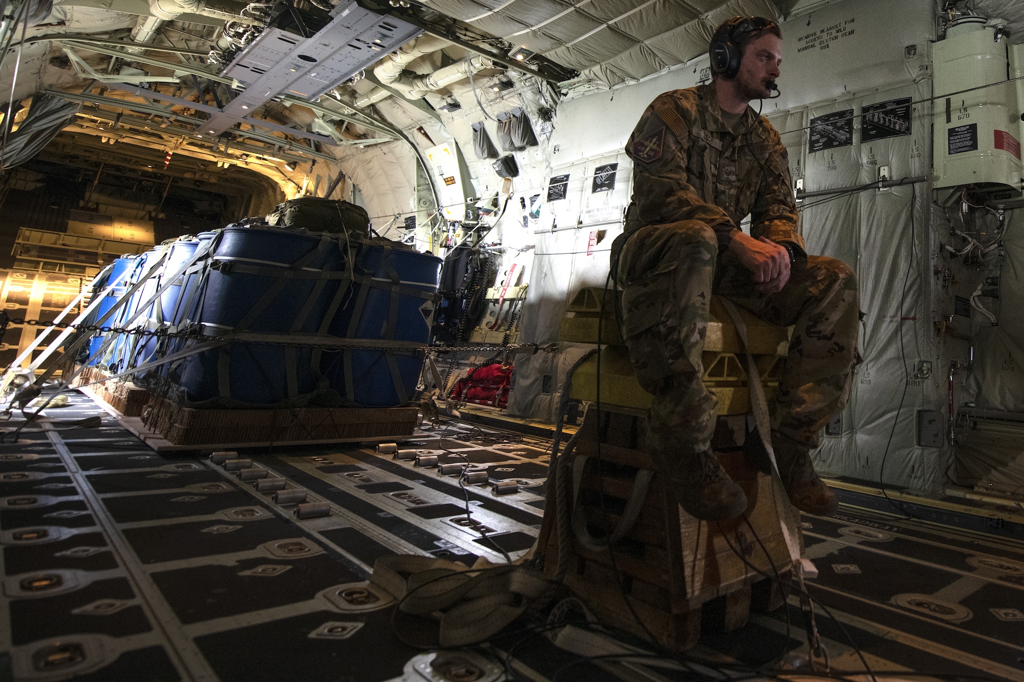 Tech Sgt. Wesley Zech, 36th Expeditionary Airlift Squadron loadmaster, waits to arrive at a drop zone on a C-130J Super Hercules during a bilateral air drop training mission as part of Exercise Cope South 2022, Feb. 20, 2022, over Bangladesh. Airmen assigned to the 36th EAS worked side-by-side with Bangladesh air force (BAF) pilots and maintainers to perform air drops and low level flying as part of the day’s tasks. Exercise Cope South provides an opportunity for Pacific Air Forces and the Bangladesh armed forces to strengthen their relationship and enhance interoperability, to operate more effectively together when needed.