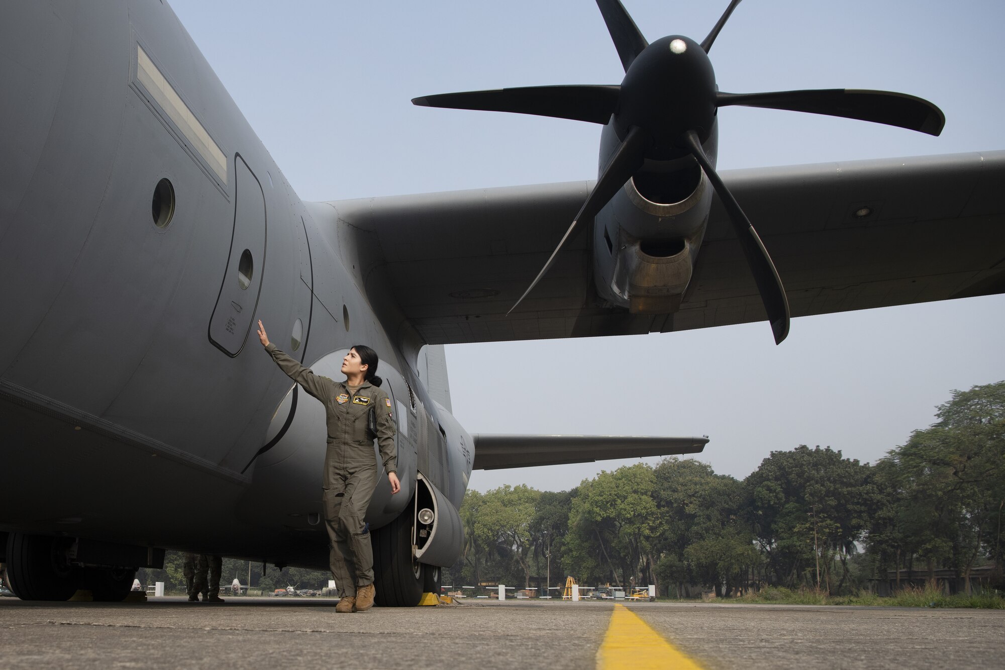 Senior Airman Kristen Garcia, 36th Expeditionary Airlift Squadron loadmaster, inspects a C-130J Hercules prior to launch in support of static line and high altitude, low opening (HALO) jumps during Exercise Cope South 2022 Feb. 22, 2022, at Bangladesh air force (BAF) Base Bangabandhu, Bangladesh. U.S. and Bangladesh air forces conducted static line and HALO jumps during the exercise. The bilateral exercise provides an opportunity for Pacific Air Forces and the BAF to strengthen their relationship and enhance interoperability, to operate more effectively together when needed.