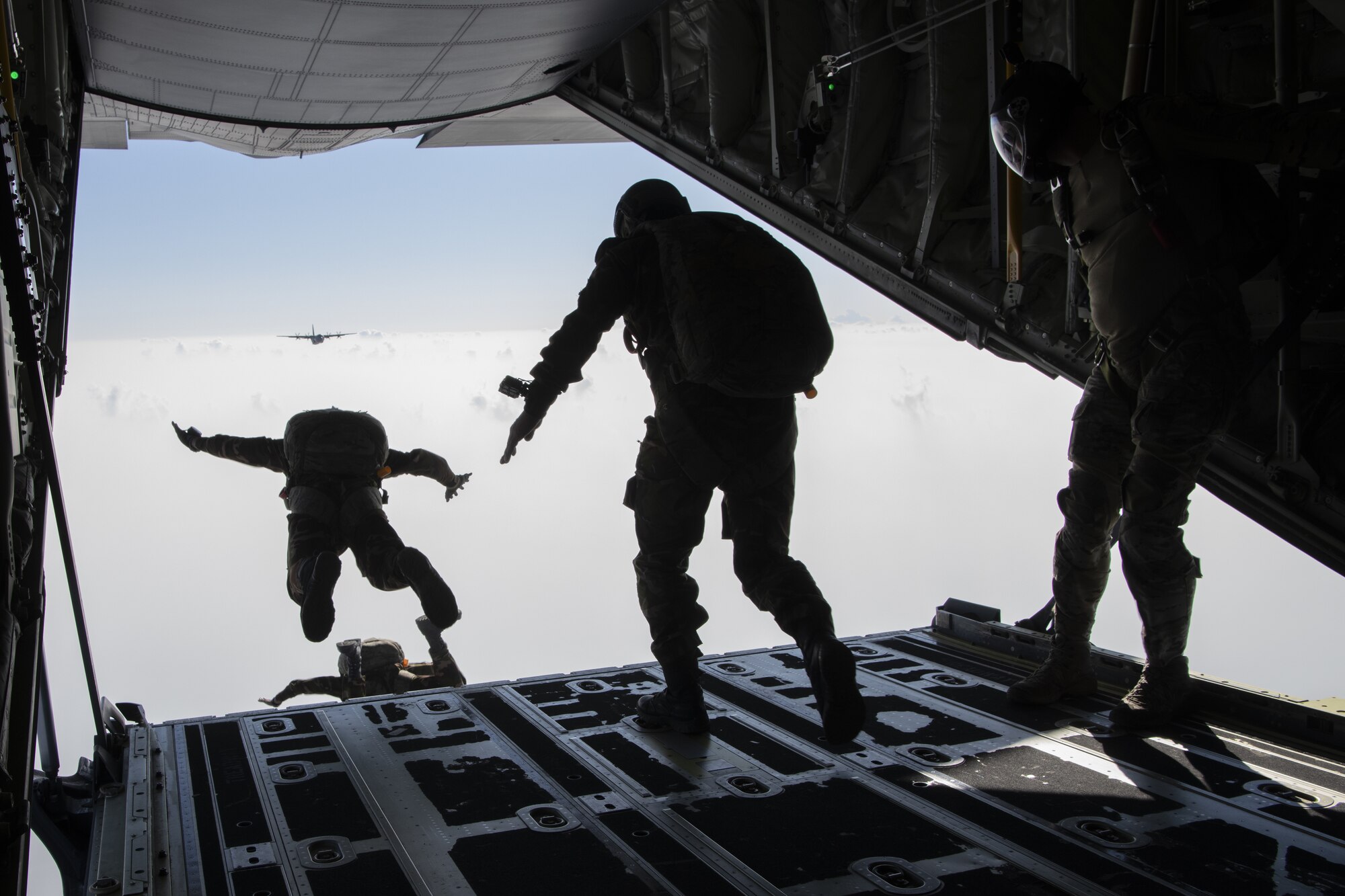U.S. Air Force Tech Sgt. Seth Sarret, 36th Expeditionary Airlift Squadron jumpmaster, observes Bangladesh armed forces members as they jump from a C-130J Super Hercules during a high altitude, low opening (HALO) jump as part of Exercise Cope South 2022, Feb. 22, 2022, over Bangladesh. U.S. and Bangladesh air forces (BAF) conducted static line and HALO jumps during the exercise. The bilateral exercise provides an opportunity for Pacific Air Forces and the BAF to strengthen their relationship and enhance interoperability, to operate more effectively together when needed.