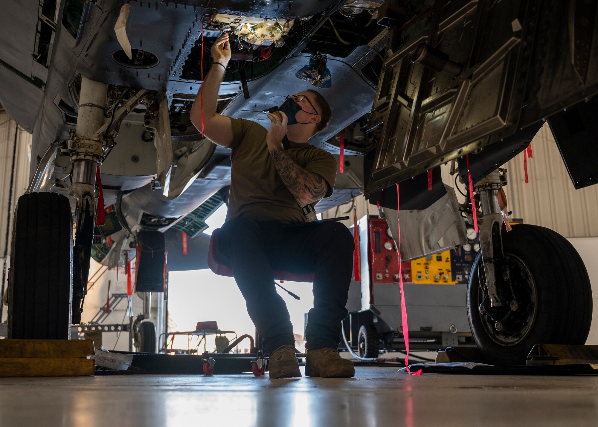 Senior Airman Carmen Melocchi, 4th Component Maintenance Squadron electro-environmental technician, inspects components on an F-15E Strike Eagle at Seymour Johnson Air Force Base, North Carolina, Feb. 10, 2022.