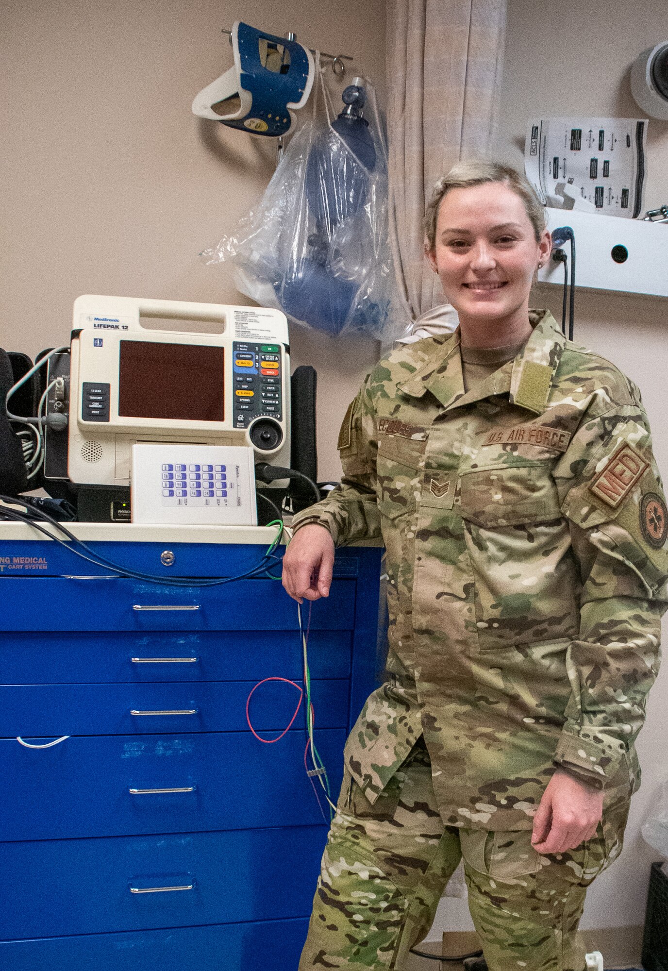 Staff Sgt. Abby Eccles, 932nd Medical Squadron medical technician, poses for an environmental photo in a 932nd MDS treatment room.  “The favorite part of my job is building interpersonal relationships with my patients in the healthcare setting while aiding them in the healing process,” said Eccles.