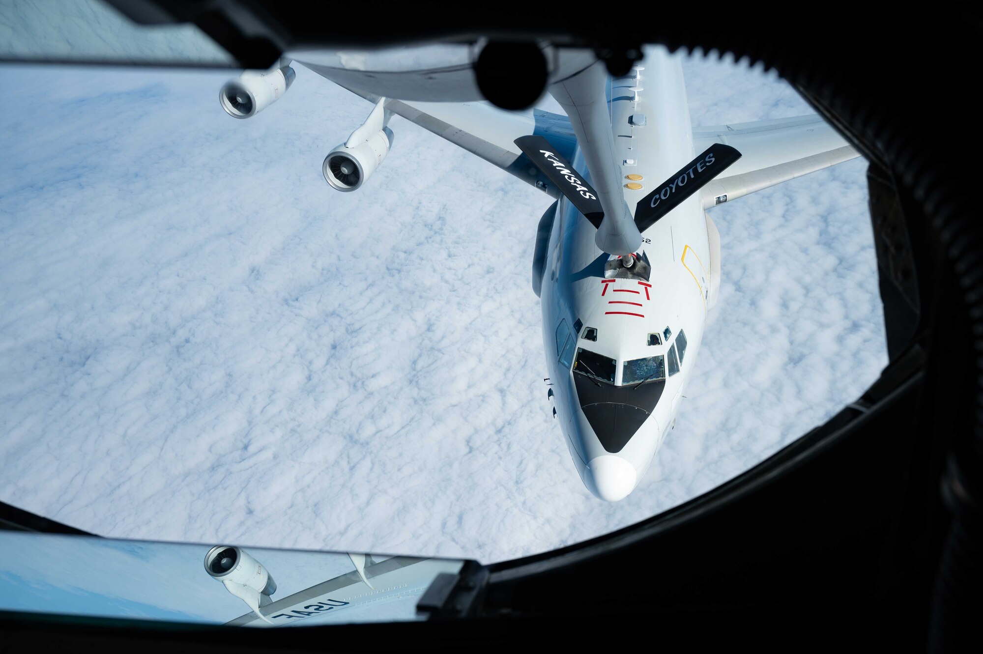 An aircraft receives fuel while flying