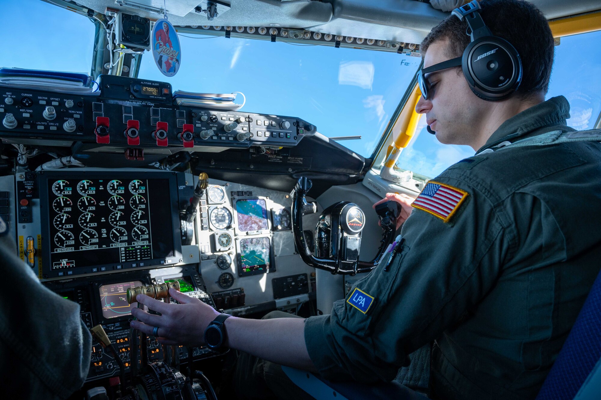 A pilot sits in the cockpit