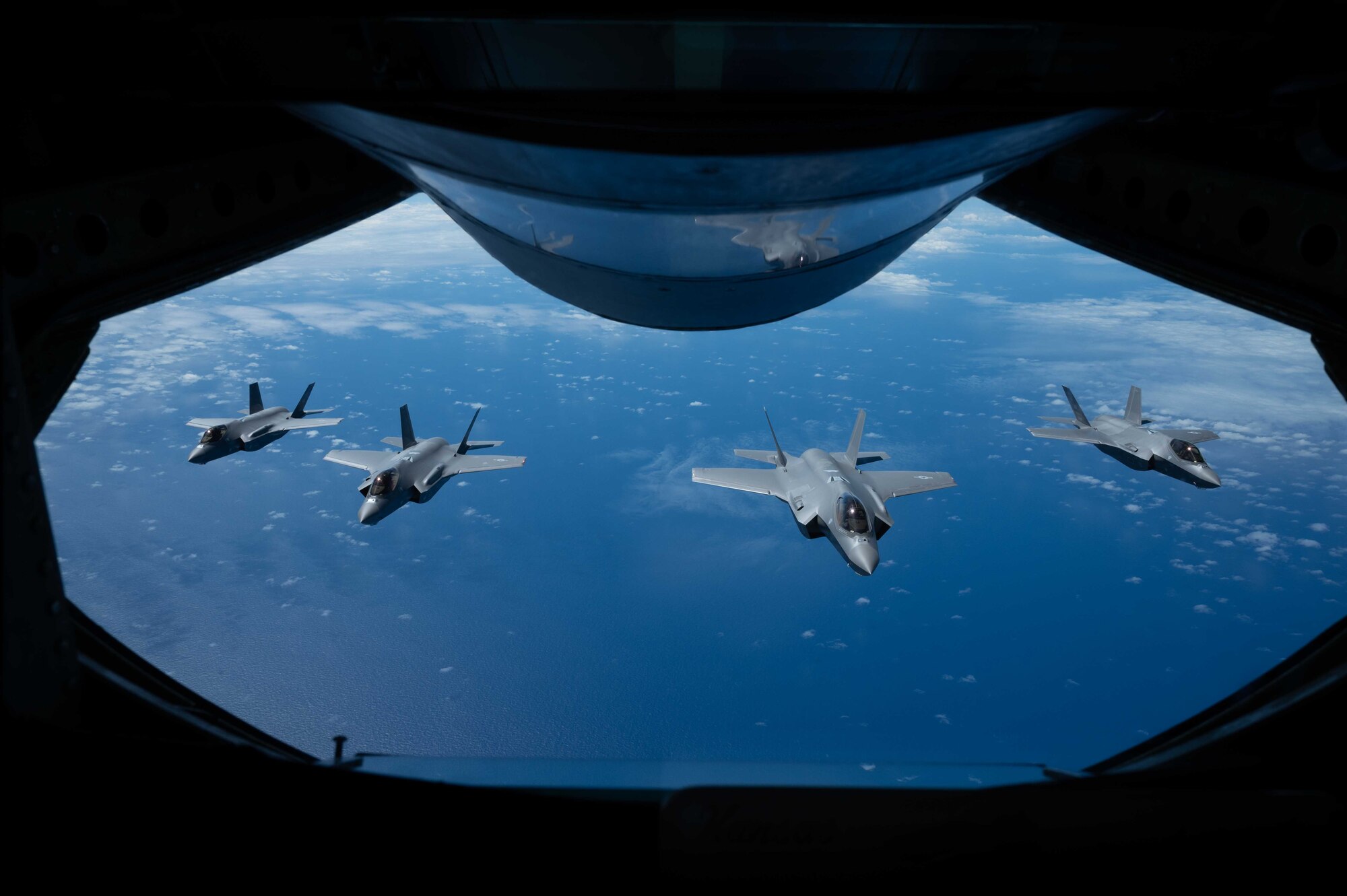 Four jets fly in a formation