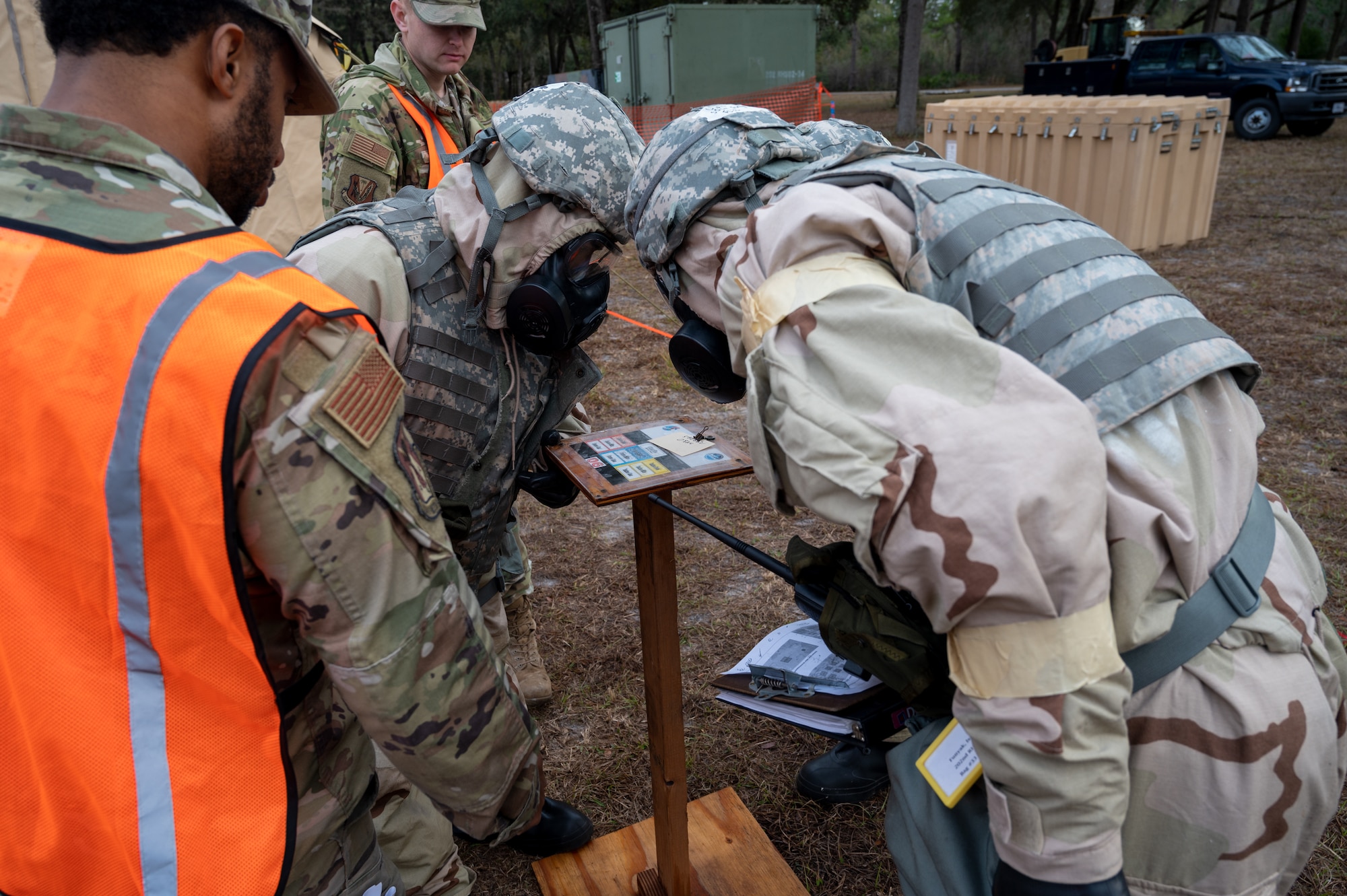 Airmen of the 202nd RED HORSE Squadron perform as members of a post attack reconnaissance team in a contingency exercise during a simulated attack at Camp Blanding Joint Training Center in Starke, Florida. This exercise marked the completion of the squadron's second phase of training before deploying overseas.