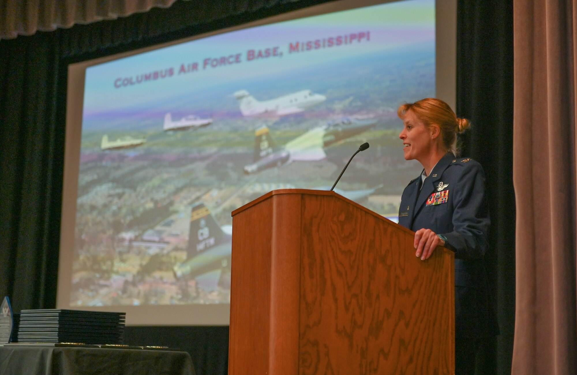 U.S. Air Force Col. Kristen Thompson, 55th Wing commander, speaks at the graduation ceremony of Specialized Undergraduate Pilot Training Class 22-06 on March 4, 2022, at Columbus Air Force Base, Miss. The 55th Wing, primarily stationed at Offutt AFB, Nebraska, provides dominant intelligence, surveillance and reconnaissance, electronic warfare, and nuclear command, control and communications to national leadership and warfighters. (U.S Air Force photo by Senior Airman Davis Donaldson)