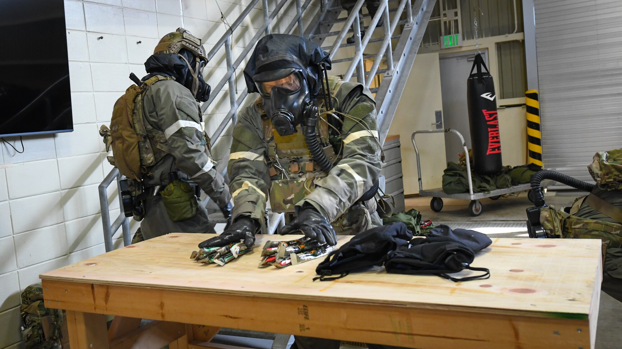 Photo of operator setting up supply table.