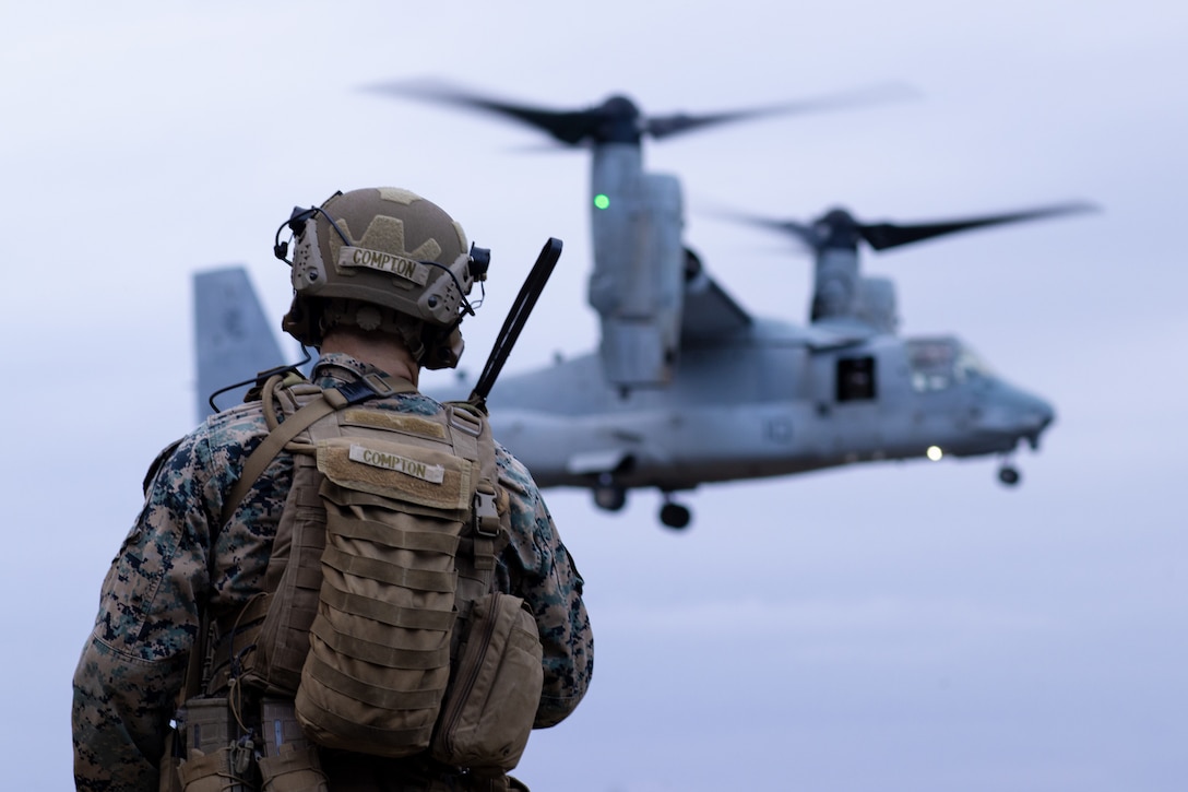 U.S. Marine Corps 1st. Lt. Trevor Compton, the tactical recovery of aircraft and personnel (TRAP) force commander with Battalion Landing Team 1/5, 31st Marine Expeditionary Unit (MEU), awaits the arrival of an MV-22B Osprey with Marine Medium Tiltrotor Squadron (VMM) 265 (Reinforced) during a TRAP exercise on Camp Hansen, Okinawa, Japan, Feb. 9, 2022. Along with personnel and aircraft recovery, TRAP teams are also tasked with destroying sensitive material when deemed necessary, in order to deny the enemy access. The 31st MEU is operating aboard ships of America Expeditionary Strike Group in the 7th fleet area of operations to enhance interoperability with allies and partners and serve as a ready response force to defend peace and stability in the Indo-Pacific region. (U.S. Marine Corps photo by Lance Cpl. Cesar Ronaldo Alarcon)