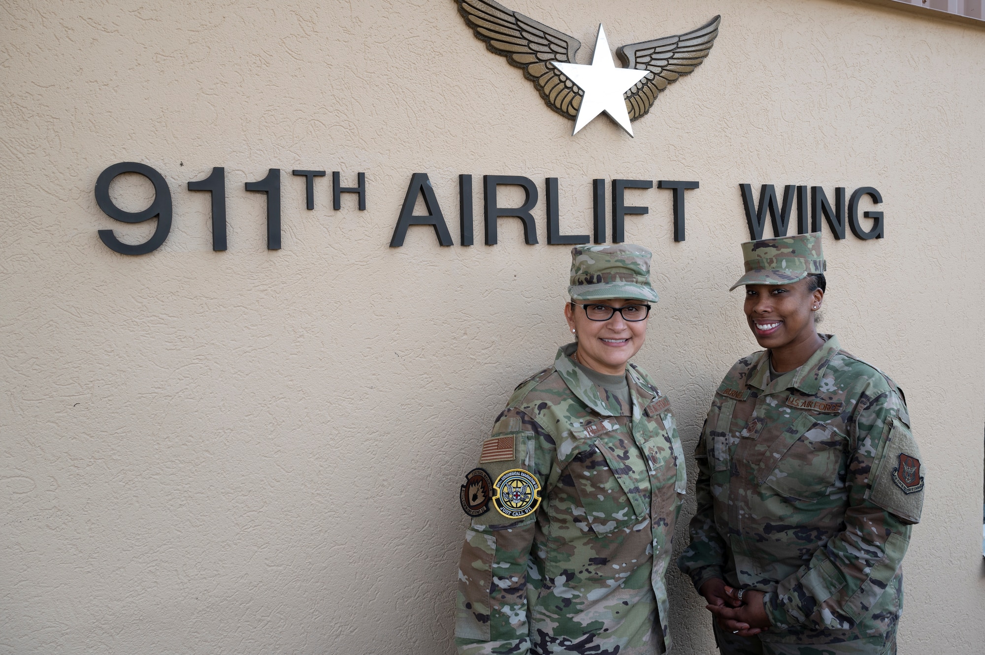Chief Master Sgt. Cynthia Villa, 4th Air Force command chief, and Chief Master Sgt. Jamesha Barnes, 911th Airlift Wing command chief, pose for a photo at the Pittsburgh International Airport Air Reserve Station, Pennsylvania, March 6, 2022.