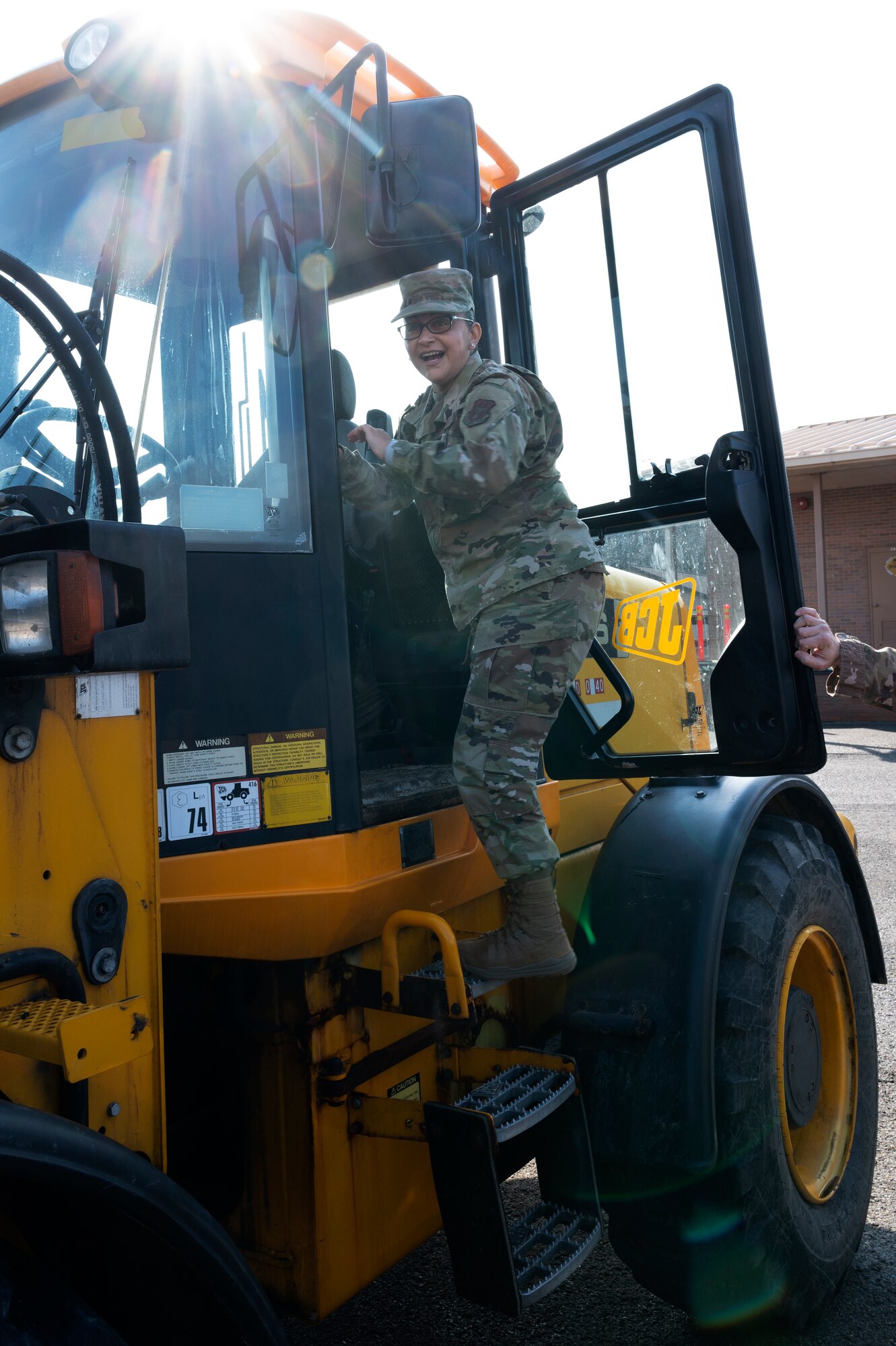 Chief Master Sgt. Cynthia Villa, 4th Air Force command chief, gets into a 10k front end loader at the Pittsburgh International Airport Air Reserve Station, Pennsylvania, March 6, 2022.