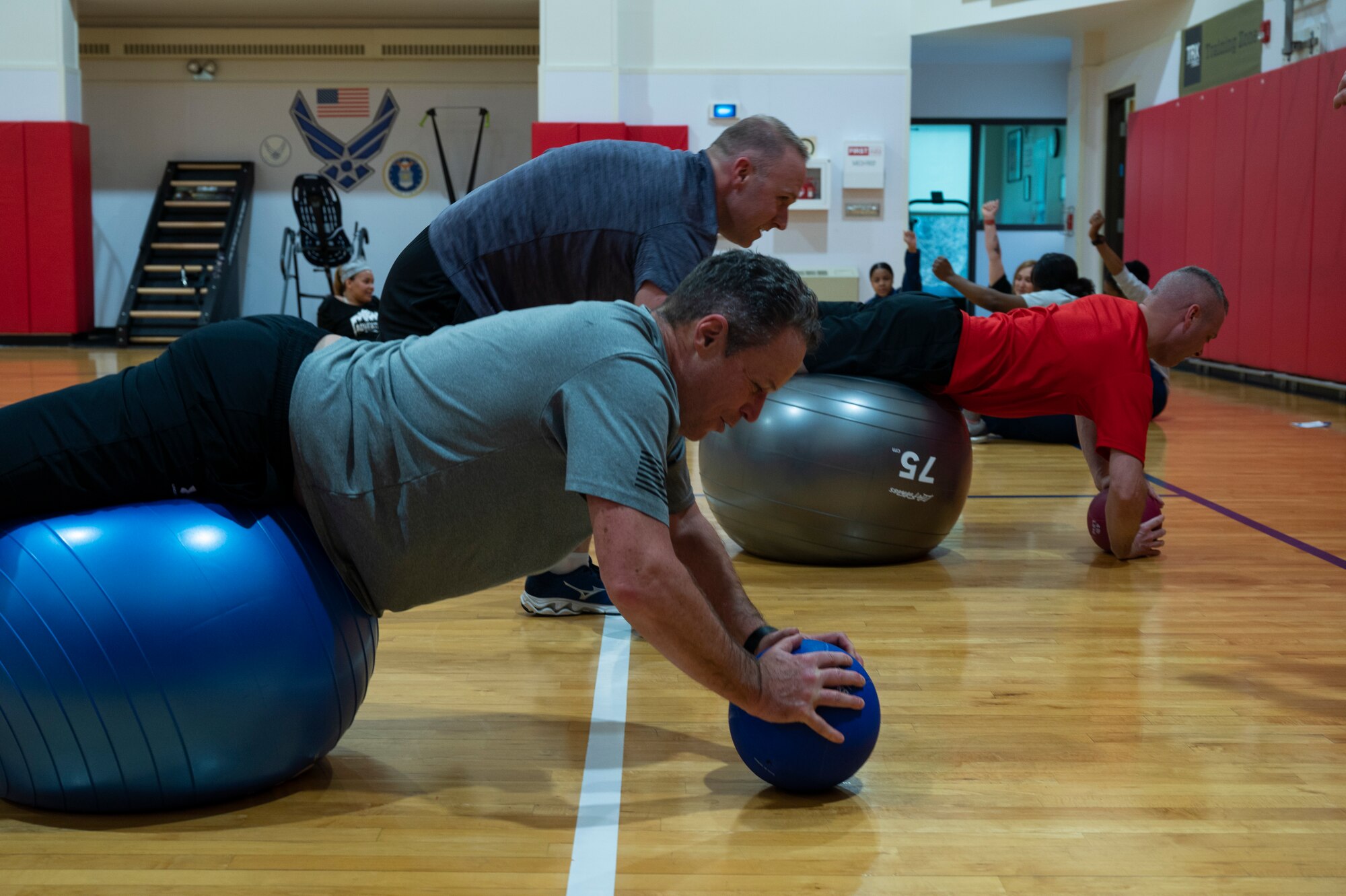 Lowell T. Bingham, 911th Airlift Wing Chief of Staff, performs push-ups on an exercise ball at the Pittsburgh International Airport Air Reserve Station, Pennsylvania, March 5, 2022.