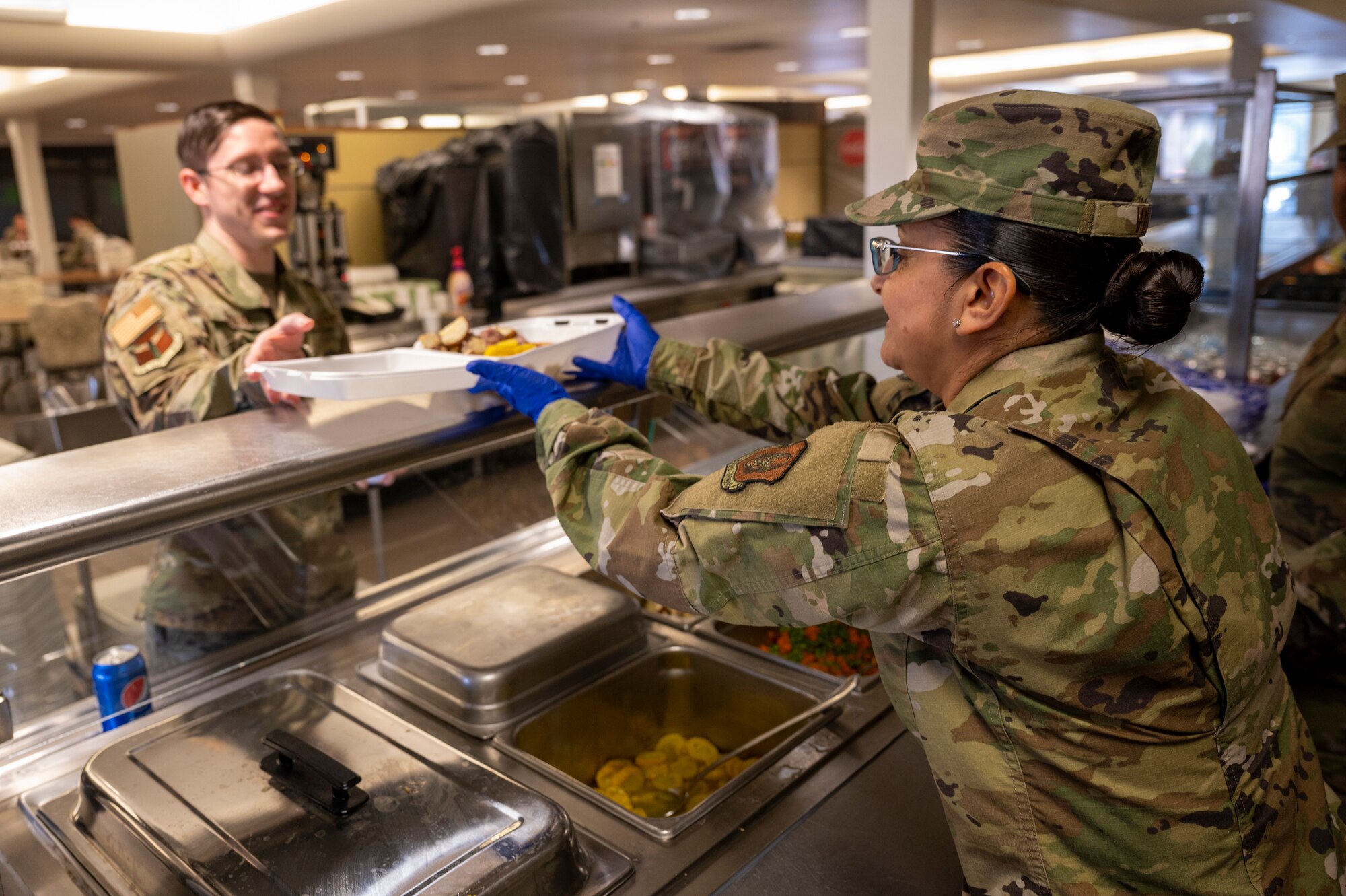 Chief Master Sgt. Cynthia Villa, the 4th Air Force Command Chief, gets into a 10k front end loader at the Pittsburgh International Airport Air Reserve Station, Pennsylvania, March 6, 2022.