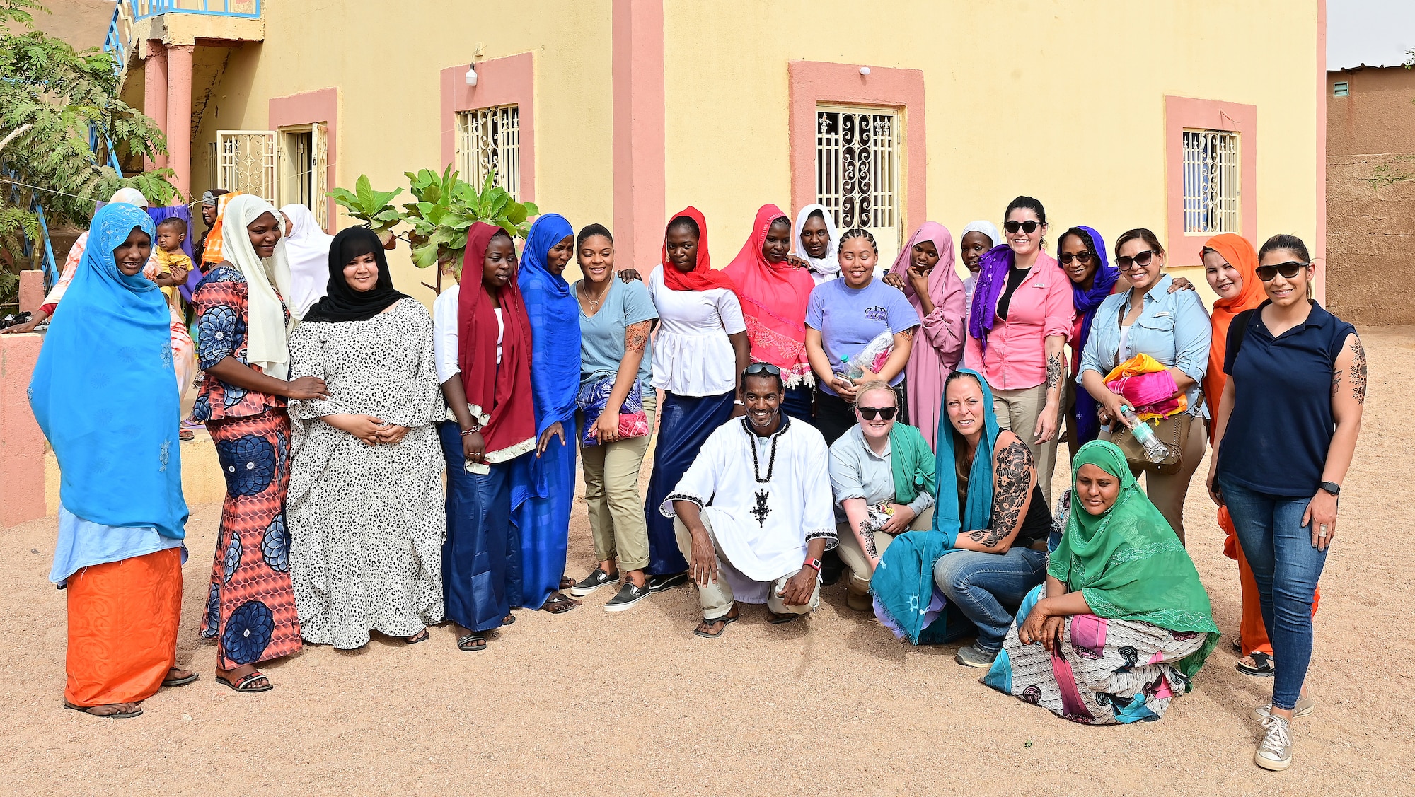 The Air Base 201 Women’s Association and Tedhilt Women’s Association pose for a group photo during an International Women’s Day celebration in Agadez, Niger, March 6, 2022. International Women’s Day (March 8) is a global day celebrating the social, economic, cultural, and political achievements of women. It also raises awareness against bias and accelerates gender equality. (U.S. Air Force photo by Tech. Sgt. Stephanie Longoria)