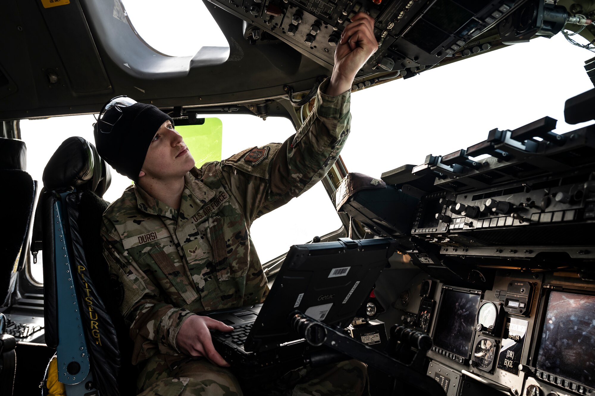 Airman 1st Class Ethan Dursi, 911th Aircraft Maintenance Squadron hydraulics technician, conducts power up procedures on a C-17 Globemaster III during a pre-flight inspection at the Pittsburgh International Airport Air Reserve Station, Pennsylvania, March 1, 2022.