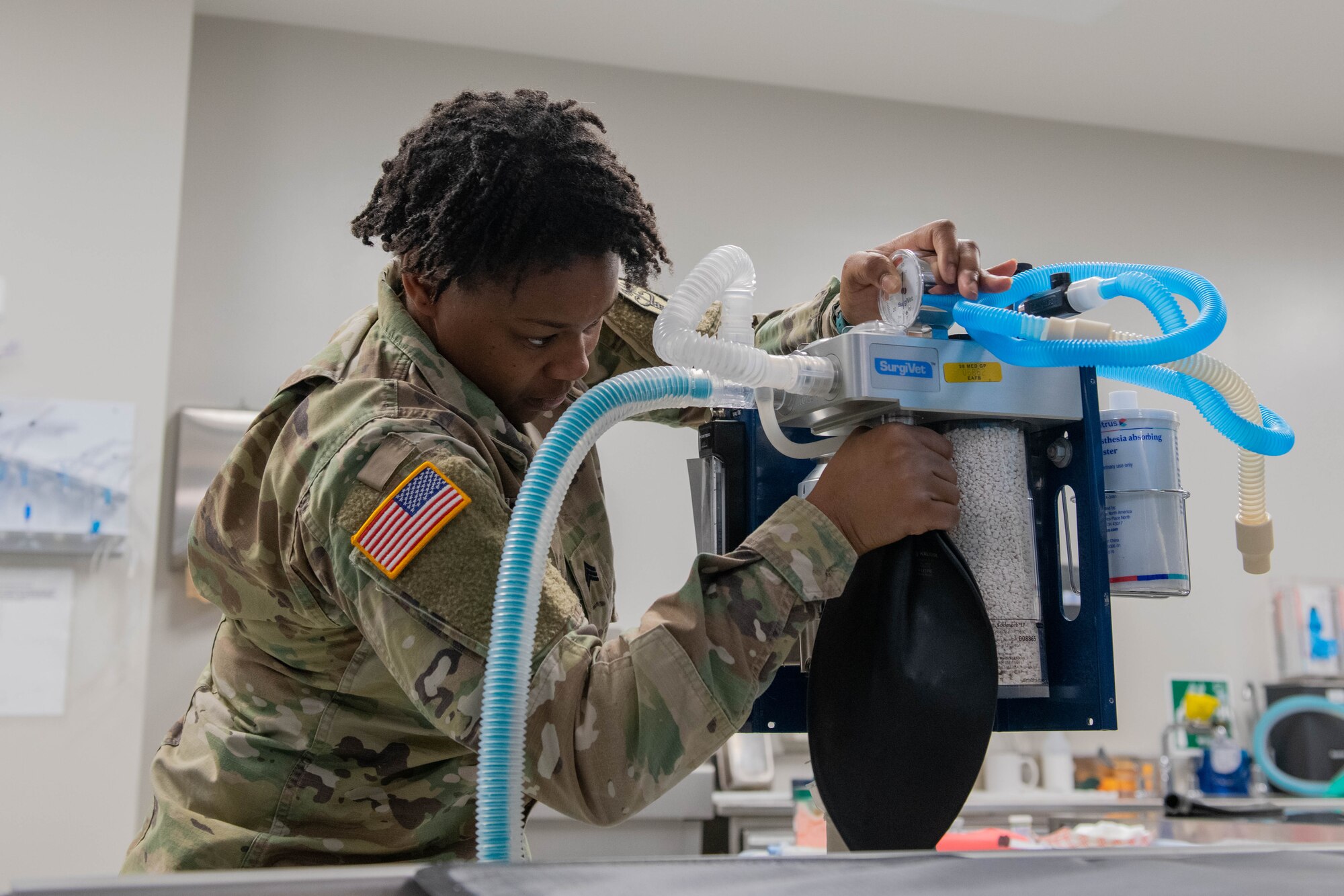 U.S. Army Staff Sgt. Shyyandria Walker, animal care specialist, pressure checks an anesthesia machine at Ellsworth Air Force Base.