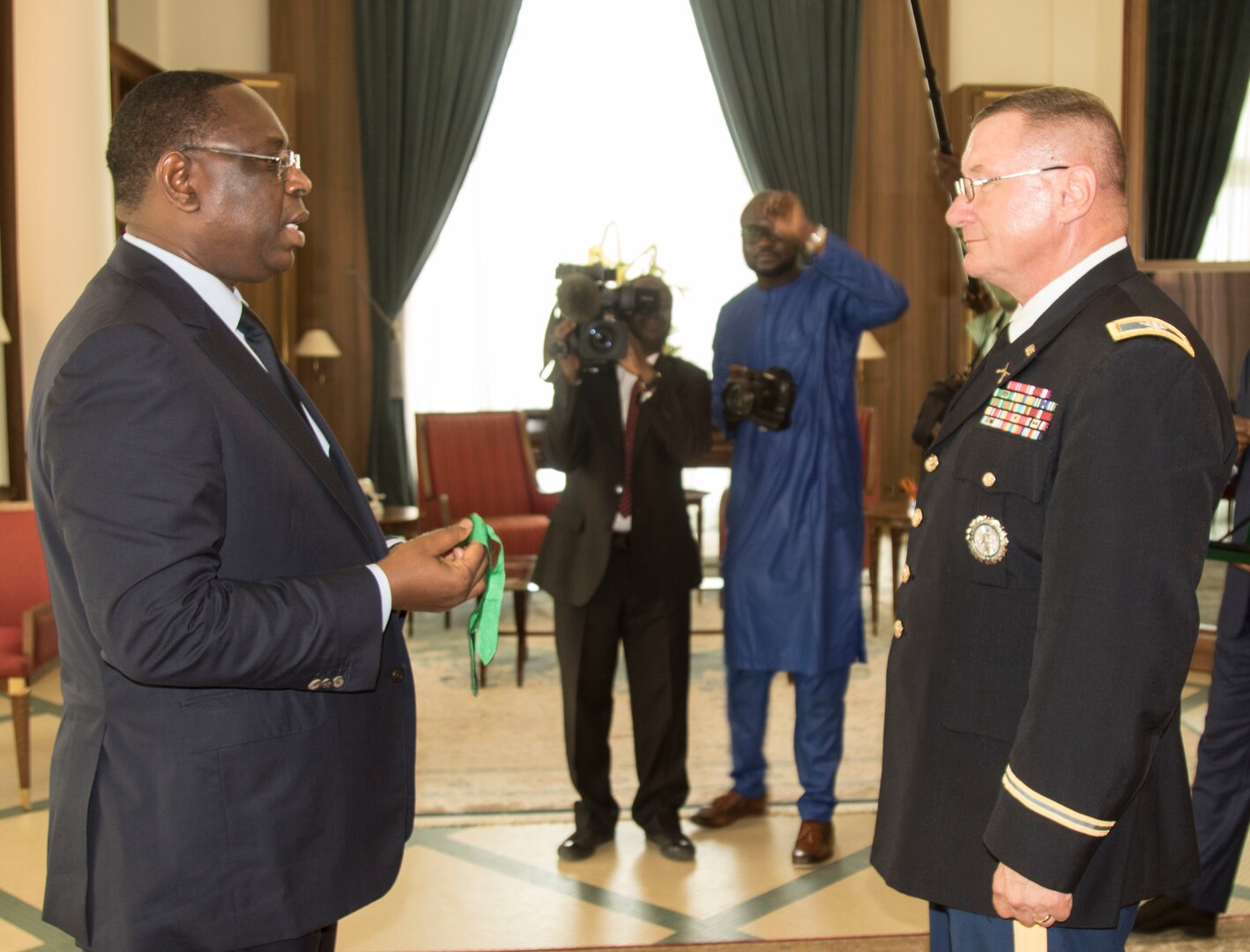 Vermont Adjutant General Col. Gregory Knight receives the Presidential Order of the Lion from President Macky Sall on July 4th, at the presidential palace in Dakar, Senegal. The Vermont National Guard and Senegal have been partners for eleven years in the State Partnership Program administered by the United States National Guard Bureau. (Photo by U.S. Army National Guard Sgt. 1st Class Jason Alvarez)
